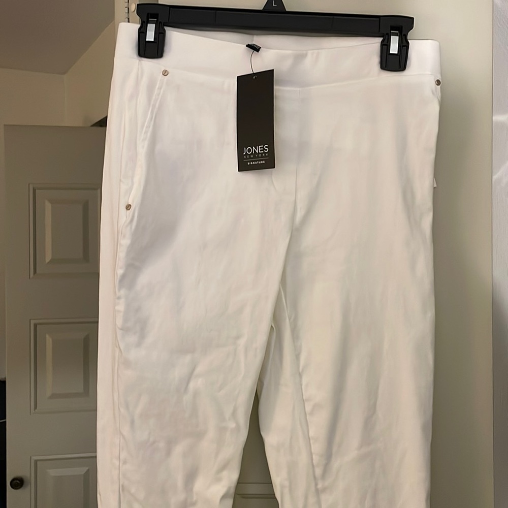All white dress pants. Stretchy xs never worn before. Comes with tags